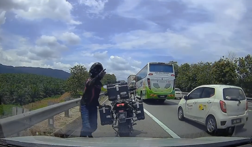 Biker blocks car using Smart Lane on toll highway 1726870